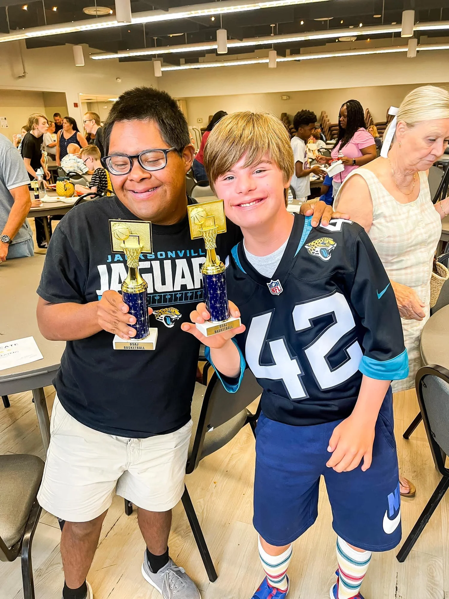 2 boys wearing jaguars jersies