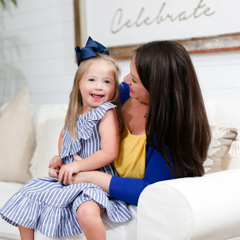 mom and daughter smiling
