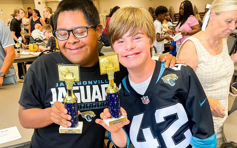 kids holding trophies