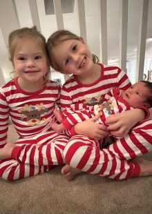 kids holding baby